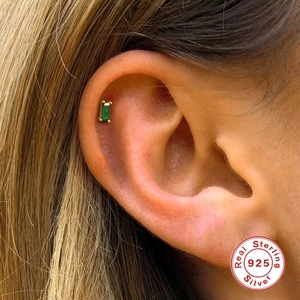 Elegant S925 sterling silver emerald cut green gemstone stud earring on ear