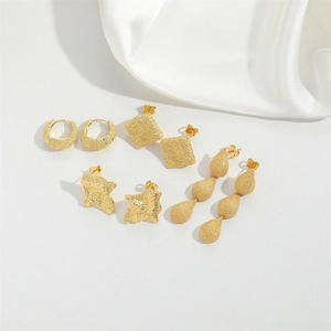 Set of four geometric matte gold earrings featuring hoop, square, and teardrop shapes