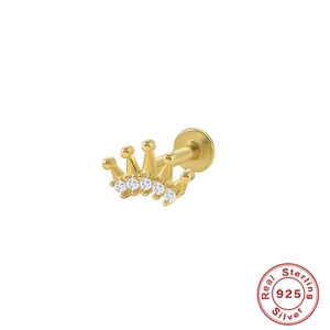 Detailed macro view of 925 sterling silver gold crown cartilage stud with sparkling zircons
