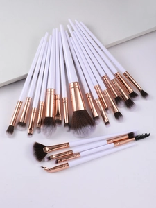 Detailed macro view of 20pcs makeup brushes with rose gold ferrules and soft bristles