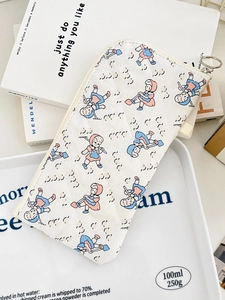 Detail of quilted cotton pencil case with vintage cartoon print and silver zipper pull