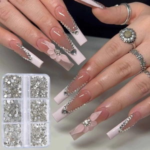 6-grid clear box of flatback white nail art rhinestones with model demonstration