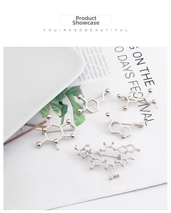 Detailed close-up of caffeine and dopamine molecular structure metal enamel pins