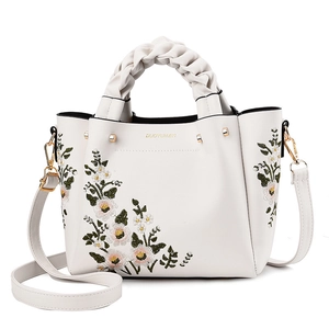 Elegant white faux leather handbag with floral embroidery and woven top handle