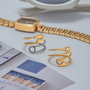 Creative safety pin wrap rings in gold and two-tone finishes with minimalist metal design