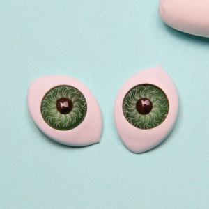 Close-up of 12x16mm green acrylic boat-shaped doll eyeballs for handicraft and DIY models