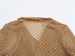 Detailed close-up of brown crochet mesh top featuring V-neckline and woven texture