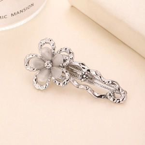 Elegant silver y2k flower hair clip with cat eye stones and sparkling rhinestones