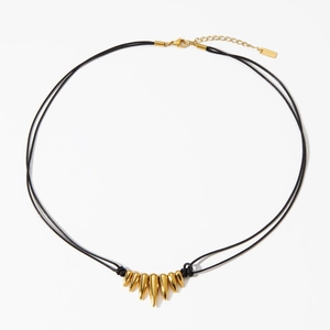 Gold stainless steel spike pendant necklace with black woven cord in hip hop style