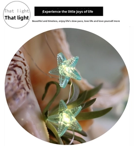 Macro detail of starfish LED string light with warm yellow glow and ocean theme decor
