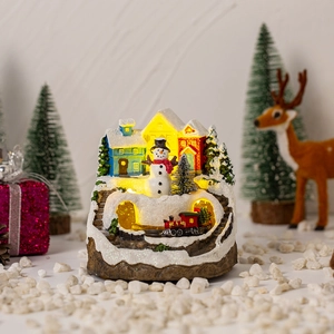 Luminous Christmas snow house with moving train and LED lights for festive decor