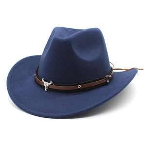 Detailed view of dark blue wool cowboy hat with leather band and metal bull head ornament