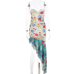 Close-up of floral print slim-fit fishtail dress with ruffle hem on a transparent mannequin