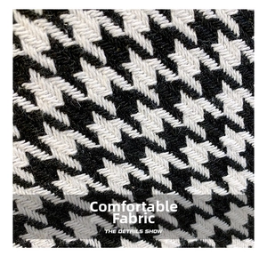 Macro shot of stylish black and white houndstooth woven fabric with fine texture detail