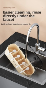 Close-up of washable four-compartment seasoning box being rinsed under kitchen tap water