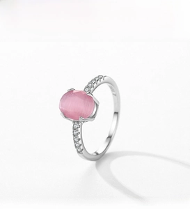 Detailed view of an S925 silver ring featuring a pink cat eye stone and pavé diamonds