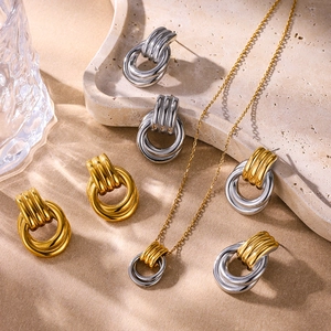Polished titanium steel jewelry set featuring ribbed ring necklace and stud earrings