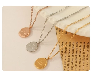 Three oval necklaces in rose gold, silver, and gold with you are adorable engraving
