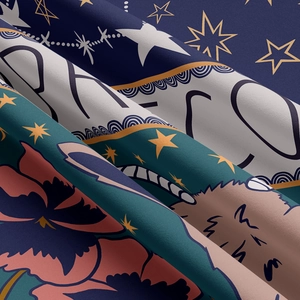 Close-up of zodiac tapestry fabric showing detailed floral patterns and star prints