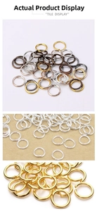 Close-up of assorted metal jump rings for DIY jewelry in gold, silver, and bronze colors