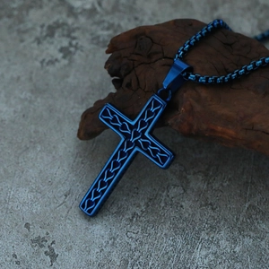 Detail of blue textured stainless steel cross pendant on a matching box chain