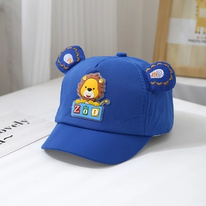 Detail of baby lion baseball cap with 3D ears and zoo patch on royal blue cotton