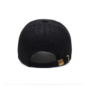 Rear view of black thermal baseball cap showing textured fabric and gold buckle