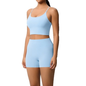 Light blue yoga set with spaghetti strap crop top and high-waisted seamless sports shorts