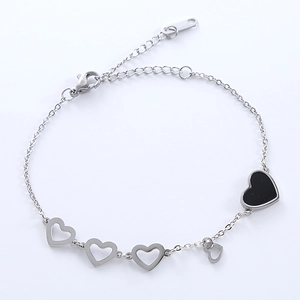 Elegant stainless steel heart charm bracelet with black enamel accents and hollow designs