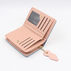 Short wallet detail showing multiple card slots, photo ID window, and pink cat charm