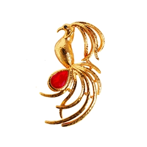 Golden phoenix brooch with red teardrop gemstone and textured feather details