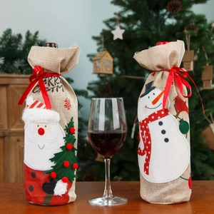 Burlap Christmas wine bottle covers featuring Santa and Snowman embroidery for holiday decor