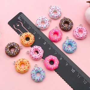Handmade colorful resin donut pendants with sugar sprinkles for DIY jewelry making