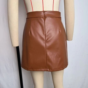 Detail view of the high waist brown faux leather mini skirt with hidden back zipper