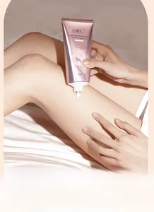 Applying creamy brightening body lotion on legs for a smooth skin tone