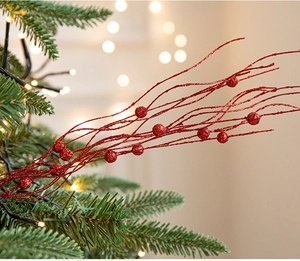 Macro shot of red glitter Christmas floral picks for festive tree and wreath decor