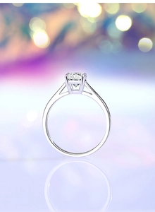 Macro side view of 1.0ct moissanite ring with hollow four-prong setting in silver
