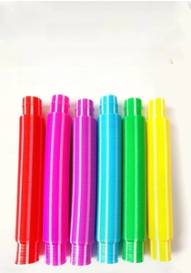 Close-up of six colorful pop tubes showing corrugated texture and flexible plastic material