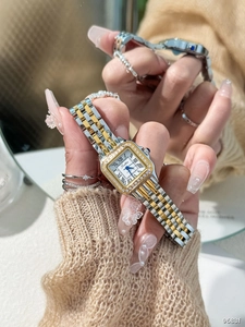 Detail of square lady watch with diamond bezel and two-tone steel bracelet on wrist