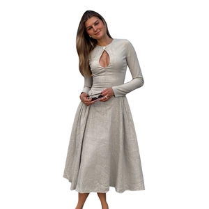 Long sleeve crew neck dress in light grey with cutout detail and flared A-line silhouette