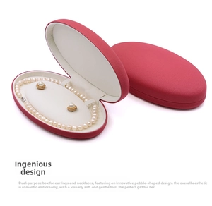 Oval red leather jewelry box with pearl necklace set in a pebble-shaped design