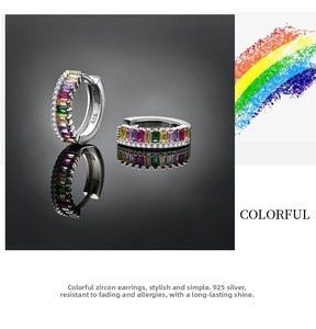 Detail of 925 sterling silver huggie earrings with rainbow baguette cubic zirconia gems