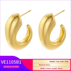 Detail view of gold brass C-shape drop earrings with product dimensions and specs