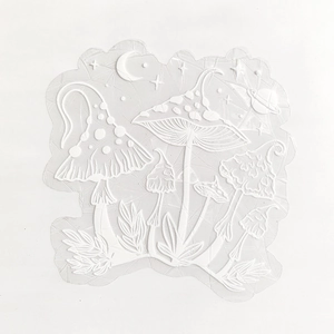 Detail of embossed mushroom and celestial PVC window decal with 3D suncatcher effect