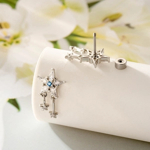 Star-shaped tassel stud earrings in silver with blue and clear zircon inlay
