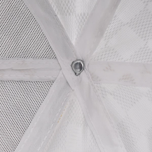 Close-up of white mesh fabric interior and reinforced metal button on a baseball cap