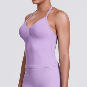 Detail of lilac purple sports vest featuring a ribbed V-neck and ruched bust design