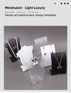 Various acrylic jewelry display stands for necklaces and earrings in black and white