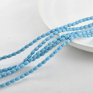 Detailed view of turquoise blue oval beads for DIY necklaces and handmade bracelets