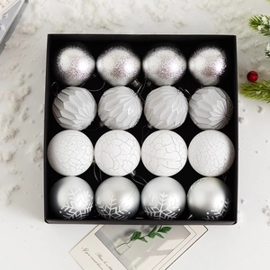Close-up of 16-piece silver and white assorted Christmas ball ornaments in gift box